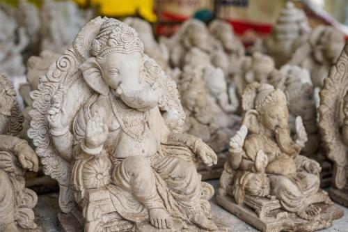 a group of white stone sculptures on a table at Radisson Blu Pune Hinjawadi in Pune