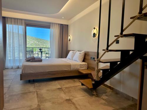 a bedroom with a bed and a balcony at Minimalist suites in Potos