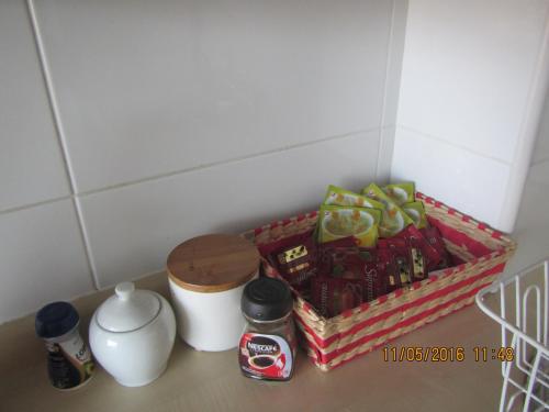 a basket of food sitting next to a coffee maker at Departamentos Parque Costanera in Antofagasta
