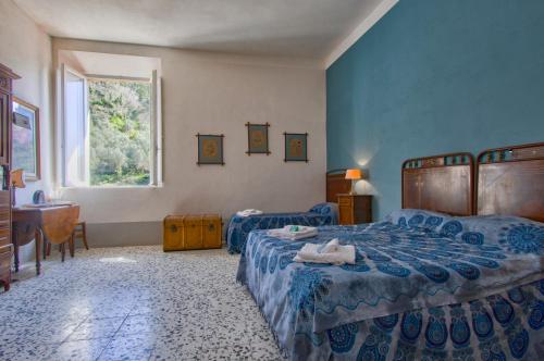 Ένα ή περισσότερα κρεβάτια σε δωμάτιο στο Palazzetto d'epoca