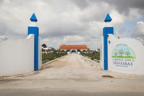 a gate to the entrance to a villa dos universitas at QUINTA das OLIVEIRAS COUNTRY HOUSE in Marinhais