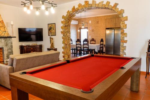 a living room with a pool table at QUINTA das OLIVEIRAS COUNTRY HOUSE in Marinhais