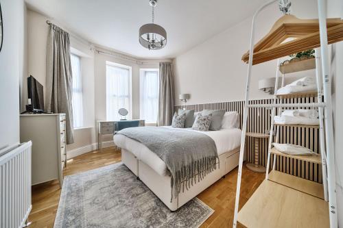 a bedroom with a bed and a mirror at Number 5 in Margate