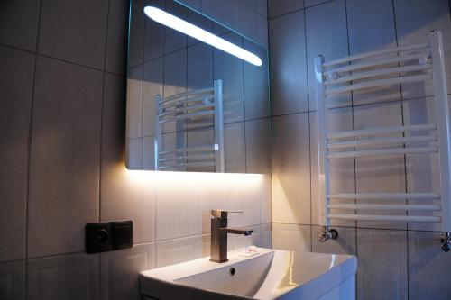 a bathroom with a sink and a mirror at Cascade Resort Sevan in Sevan