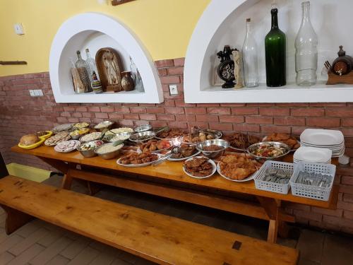 a table with many different dishes of food on it at Vinný sklep u Osičky in Prušánky