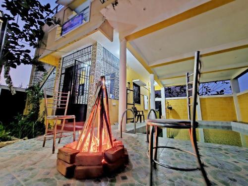 a statue of a person standing on a patio at paradise beach resort pondicherry in Pūrnānkuppam