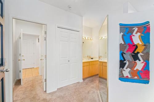 a bathroom with a mirror and a sink at Alpine Studio at Mount Bachelor Village Resort with Pool and Hot Tub in Bend