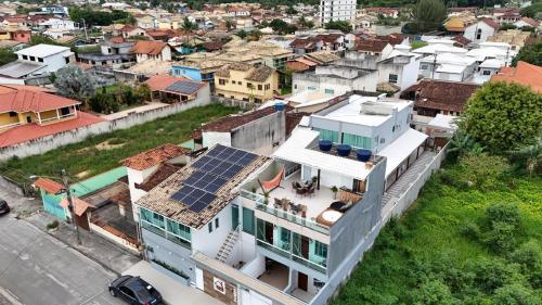 an overhead view of a house with a solar panel on the roof at Loft Casa Feliz in Rio das Ostras