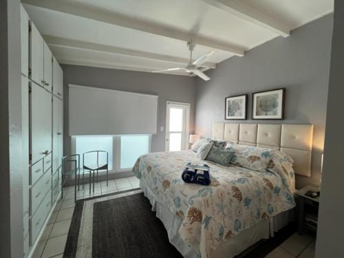 a bedroom with a bed with a bag on it at Sea Crest in Sarasota