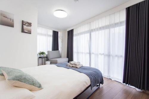 Ένα ή περισσότερα κρεβάτια σε δωμάτιο στο Natsumiホテル 高级独栋别墅301