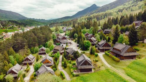 an aerial view of a village in the mountains at Resort Drevenice Terchova in Terchová