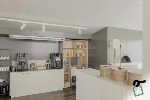 Kuchyň nebo kuchyňský kout v ubytování Hotiday Milano Marittima Pineta