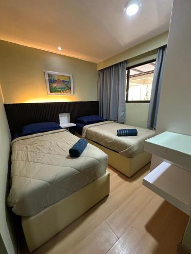 Postel nebo postele na pokoji v ubytování AJ's Regency Tanjung Tuan Beach Resort, Port Dickson, Malaysia - Seafront apartments