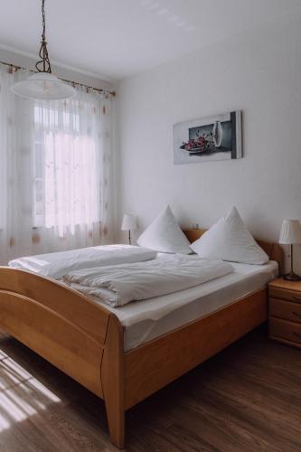 Ένα ή περισσότερα κρεβάτια σε δωμάτιο στο Europa Residenz Bad Füssing