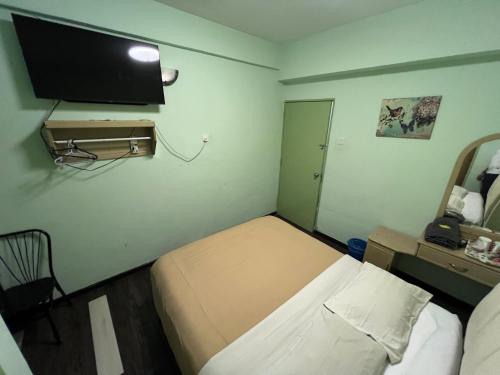 Ένα ή περισσότερα κρεβάτια σε δωμάτιο στο KISABEL Budget Hotel