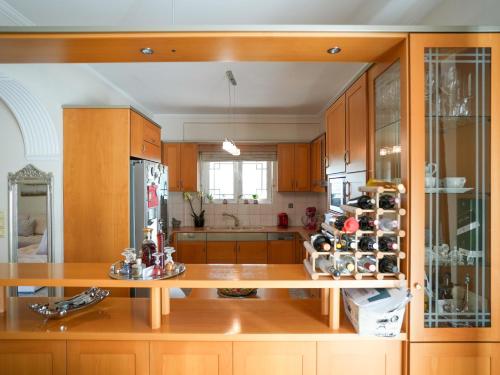 a large kitchen with wooden cabinets and a counter top at Villa Elysian in Antimácheia