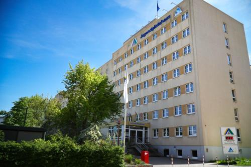 a building with a flag on top of it at DJH Jugendherberge Dresden - Jugendgästehaus in Dresden