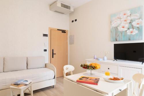 a living room with a couch and a table at Hotel Mondial in Bellaria-Igea Marina