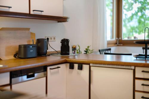 a kitchen with a counter top with a coffee maker on it at Ferienhaus Rotkreuz in Haslach im Kinzigtal