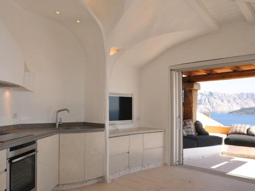 Η κουζίνα ή μικρή κουζίνα στο Villaggio Est by Holiday World