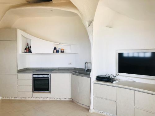Η κουζίνα ή μικρή κουζίνα στο Villaggio Est by Holiday World