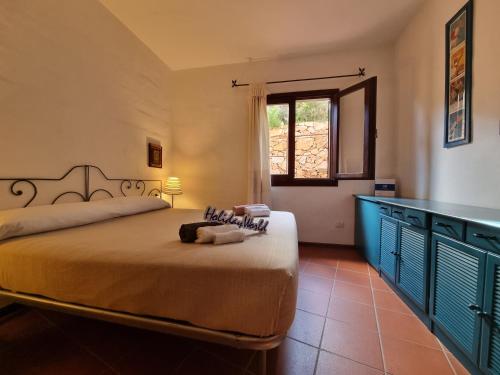 Ένα ή περισσότερα κρεβάτια σε δωμάτιο στο Villaggio Est by Holiday World
