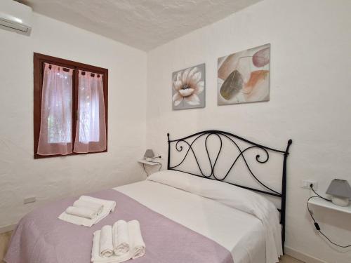 Ένα ή περισσότερα κρεβάτια σε δωμάτιο στο Villaggio Est by Holiday World