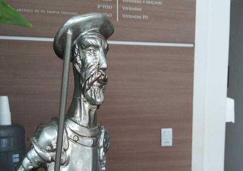 a statue of a man with a spear in his mouth at Apart Hotel Quijote by DOT Suites in Ciudad Lujan de Cuyo