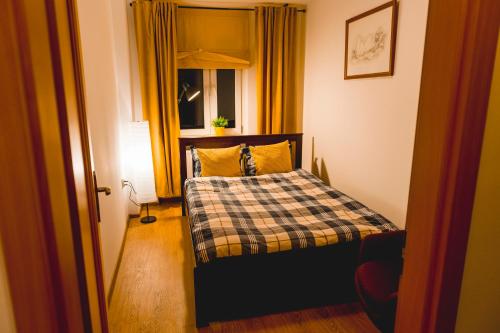 Posteľ alebo postele v izbe v ubytovaní Apartament Słoneczny