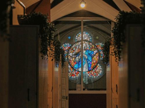 a door with a stained glass window on it at Gardiner House Hostel in Dublin