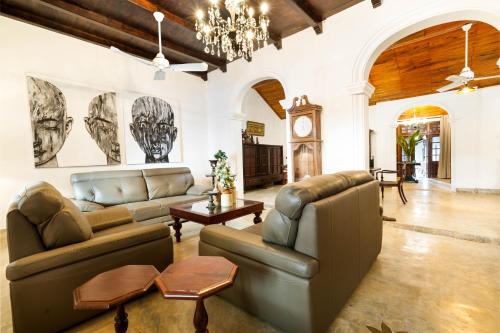 a living room with a couch and a table at Villa 20 Fort in Galle
