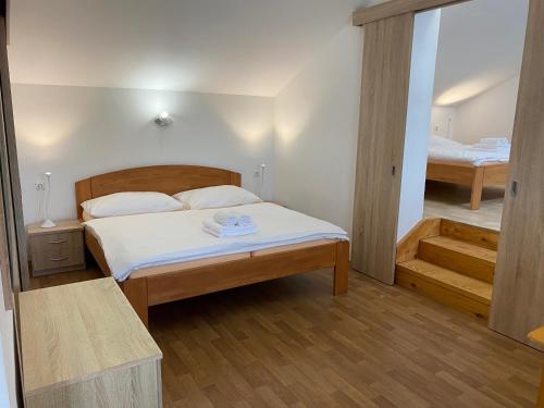 Postel nebo postele na pokoji v ubytování Penzion Trödler