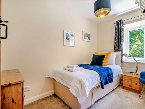 Ένα ή περισσότερα κρεβάτια σε δωμάτιο στο 4 Bed in Dorchester 92413