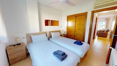 a bedroom with two beds with towels on them at Casa Indico J-Murcia Holiday Rentals Property in Sucina