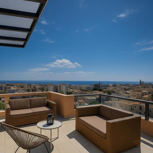 a balcony with couches and a table and a view at GP Castle Patras in Patra