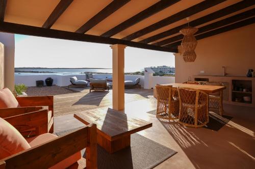 a living room with a view of the ocean at Formentera Especial in La Savina