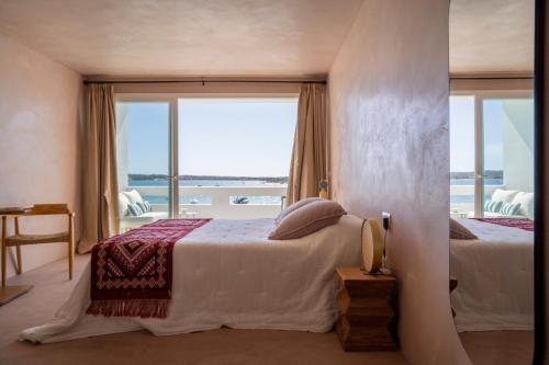 Ένα ή περισσότερα κρεβάτια σε δωμάτιο στο Formentera Especial