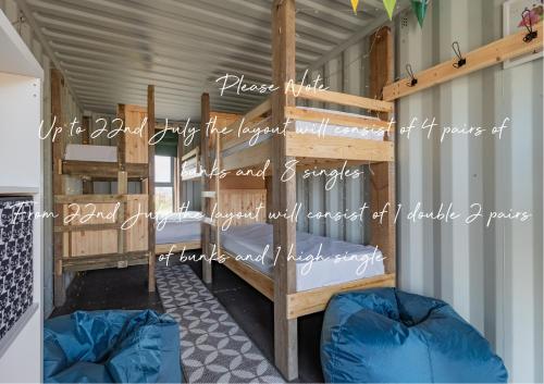 a couple of bunk beds in a room at 6 Squirrels Squat, Camp Tapnell in Yarmouth