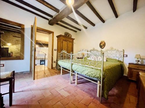 a bedroom with a bed in a room at Casina 57 in Loro Ciuffenna