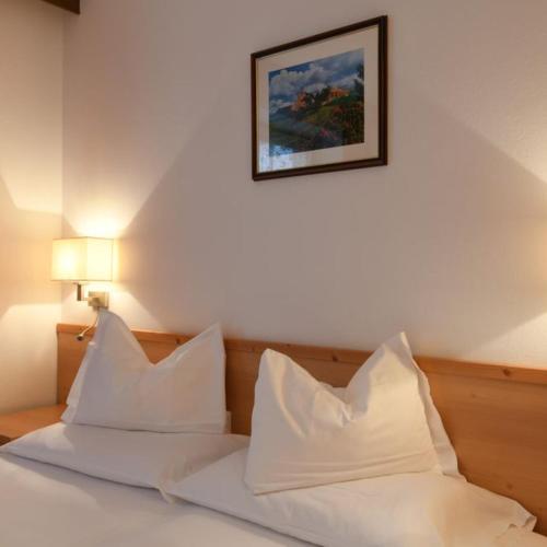 Ένα ή περισσότερα κρεβάτια σε δωμάτιο στο La Tambra - Residence - Central with Restaurant