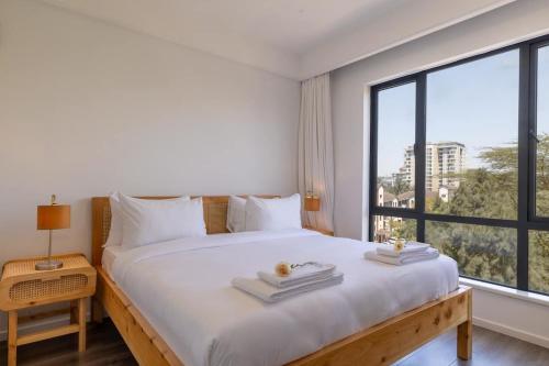 Giường trong phòng chung tại Dreams in Sunshine Alba by YourHost 1 bedNairobi