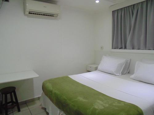 En eller flere senge i et værelse på Amarhotel