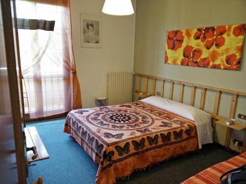 A bed or beds in a room at Le Magnolie B&B