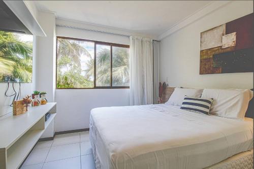 Postel nebo postele na pokoji v ubytování Barra Bali - Condomínio Pé na Areia Vista Mar