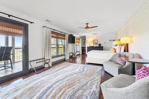 a bedroom with a bed and a living room at Iris Inn and Cabins in Waynesboro