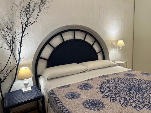 Postel nebo postele na pokoji v ubytování Appartamento a Porto Rotondo - VILLAGGIO PUNTA VOLPE - IUN S5393