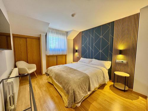 Postel nebo postele na pokoji v ubytování Hotel Ávila Diró