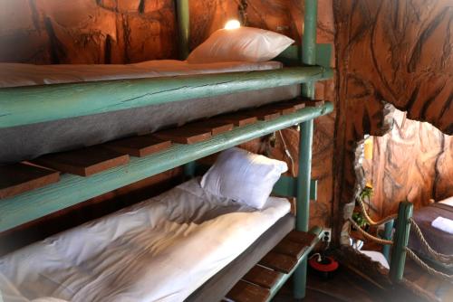a couple of bunk beds in a room at Norrqvarn Hotel & Resort by Vänerport in Lyrestad