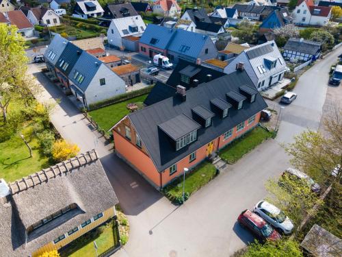 an aerial view of a house with blue roofs at NEW Stylish Coastal Retreat, 1 Min to the Ocean in Lerberget