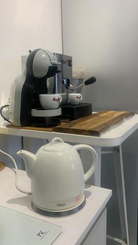 a kitchen counter with a mixer and a tea pot at B&B Passione Salento in Surbo